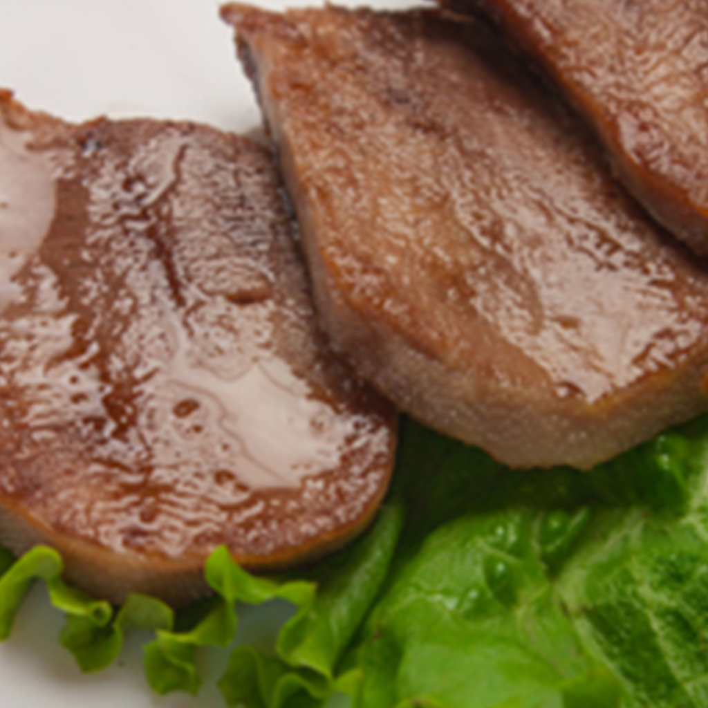 Creswick Farm's Small Beef Tongue Displayed With A Leaf Of Lettuce 